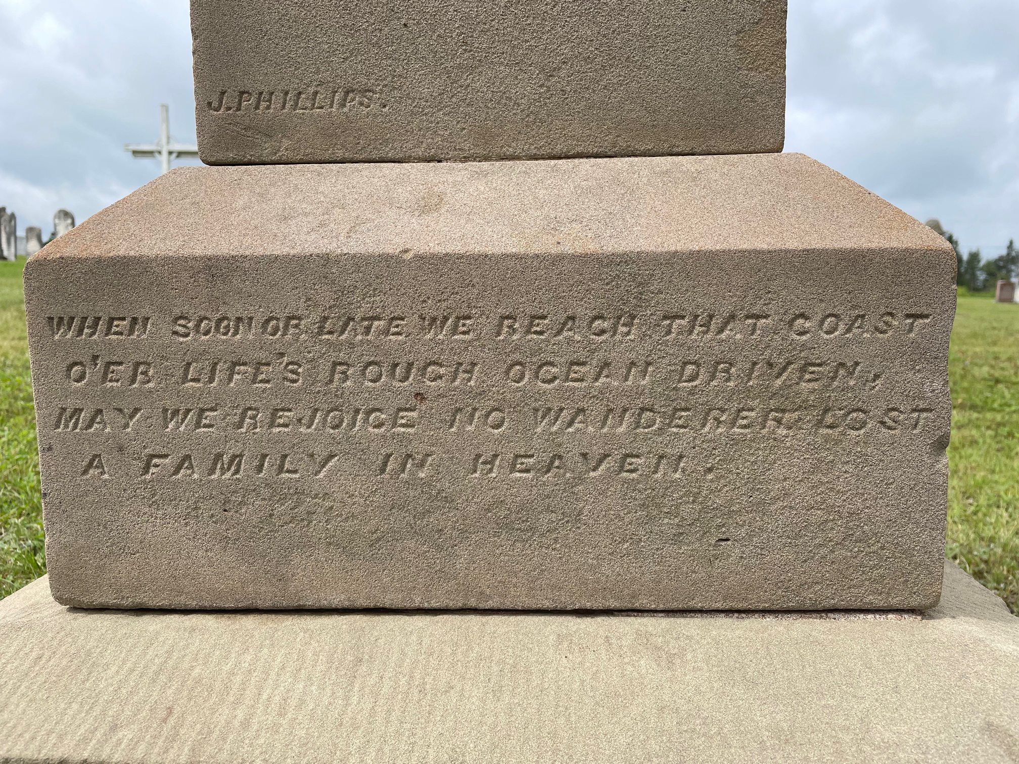 Base of James Hughes' headstone with words carved into it: When soon of late we reach that coast, O'er Life's rough ocean driven, may we rejoice no wanderer lost, a family in heaven.
